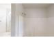 Bright bathroom features a shower with white surround and updated fixtures at 71 Thayer Se Ave, Atlanta, GA 30315