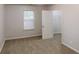 Bedroom with carpet flooring, window and large closet at 71 Thayer Se Ave, Atlanta, GA 30315