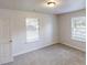 Bedroom featuring carpet flooring and bright natural light with neutral paint at 71 Thayer Se Ave, Atlanta, GA 30315