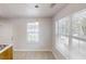Bright kitchenette with window, vinyl floors, and pendant light fixtures at 71 Thayer Se Ave, Atlanta, GA 30315