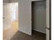 Bedroom with closet and neutral carpet, offering an open floor plan at 1169 Oaks Pl, Stone Mountain, GA 30083