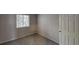 Bright bedroom with neutral carpet and natural light from large windows at 1169 Oaks Pl, Stone Mountain, GA 30083