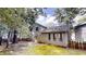 Back exterior of home features a fenced yard and back patio at 1169 Oaks Pl, Stone Mountain, GA 30083