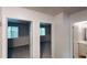 Hallway with access to bathroom and bedroom, providing ample natural light at 1169 Oaks Pl, Stone Mountain, GA 30083