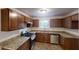 Modern kitchen featuring granite countertops, stainless appliances, and tile floors, perfect for cooking enthusiasts at 1169 Oaks Pl, Stone Mountain, GA 30083