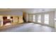 Spacious living room with ample natural light, featuring an open floor plan with seamless access to the kitchen at 1169 Oaks Pl, Stone Mountain, GA 30083