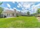 Expansive backyard with lush green grass, patio, and a privacy fence, perfect for outdoor activities at 2895 Dominion Walk Ln, Snellville, GA 30078