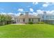 Spacious backyard with a green lawn, patio area, and privacy fence, ideal for entertaining at 2895 Dominion Walk Ln, Snellville, GA 30078