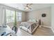This bedroom has gray floors, great light, and lots of space at 2895 Dominion Walk Ln, Snellville, GA 30078