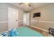 This fun bedroom has gray wood floors and lots of space at 2895 Dominion Walk Ln, Snellville, GA 30078