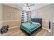 This cool bedroom has gray wood floors and lots of space at 2895 Dominion Walk Ln, Snellville, GA 30078