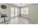 Bright dining area with a ceiling fan, french doors to the backyard, and a gray countertop at 2895 Dominion Walk Ln, Snellville, GA 30078