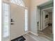 Inviting foyer with light wood floors and views to other rooms at 2895 Dominion Walk Ln, Snellville, GA 30078