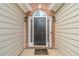 Classic black front door with sidelights and an arched brick entryway at 2895 Dominion Walk Ln, Snellville, GA 30078