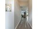 Hallway with light gray walls, trim, and wood floors at 2895 Dominion Walk Ln, Snellville, GA 30078