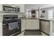Kitchen features granite countertops, stainless steel appliances, and open layout at 2895 Dominion Walk Ln, Snellville, GA 30078