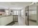 Kitchen with stainless steel appliances, granite countertops, and views to the living area at 2895 Dominion Walk Ln, Snellville, GA 30078