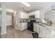Modern kitchen with white cabinets, granite countertops, and stainless steel appliances at 2895 Dominion Walk Ln, Snellville, GA 30078