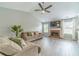 Cozy living room boasts vaulted ceiling, ceiling fan, fireplace and lots of natural light at 2895 Dominion Walk Ln, Snellville, GA 30078