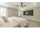 This modern main bedroom offers gray floors, TV, and neutral colors at 2895 Dominion Walk Ln, Snellville, GA 30078