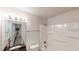 Well-lit bathroom with vanity, granite countertop, tub, and shower at 366 O Brian Dr, Stone Mountain, GA 30088