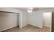 Bright bedroom featuring a ceiling fan, wood-look flooring and an open closet at 366 O Brian Dr, Stone Mountain, GA 30088