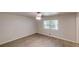 Bright bedroom featuring hardwood floors, a ceiling fan, and a large window at 366 O Brian Dr, Stone Mountain, GA 30088