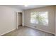 Sunlit bedroom with wood-look flooring, large window and closet at 366 O Brian Dr, Stone Mountain, GA 30088