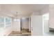 Bright breakfast nook features a modern chandelier, updated flooring, and an entrance to the laundry area at 366 O Brian Dr, Stone Mountain, GA 30088