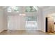 Bright dining area with hardwood floors, large windows, and a modern light fixture at 366 O Brian Dr, Stone Mountain, GA 30088
