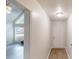 Hallway view leading to a sunlit living room with light hardwood floors at 366 O Brian Dr, Stone Mountain, GA 30088