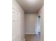 A hallway with a white door, light colored walls and hardwood floors at 366 O Brian Dr, Stone Mountain, GA 30088