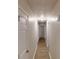 Long hallway features wood style floors, white walls, and multiple access doors at 366 O Brian Dr, Stone Mountain, GA 30088