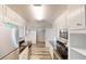 Modern kitchen features white cabinets, stainless steel appliances, and granite countertops at 366 O Brian Dr, Stone Mountain, GA 30088