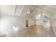Open living room features vaulted ceiling, hardwood floors, and ample natural light at 366 O Brian Dr, Stone Mountain, GA 30088