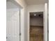 Unfinished basement with concrete floor and open door, ready for customization at 488 Barclay Ct, Stone Mountain, GA 30083