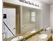 Bathroom featuring a double vanity, granite countertops, and a soaking tub at 488 Barclay Ct, Stone Mountain, GA 30083