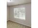 Bright bedroom featuring neutral carpet, natural light, and a window with white blinds at 488 Barclay Ct, Stone Mountain, GA 30083