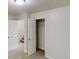 Bedroom with open closet, neutral carpet, and staircase access at 488 Barclay Ct, Stone Mountain, GA 30083