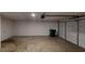 Spacious two car garage with roll-up door and extra room for storage at 488 Barclay Ct, Stone Mountain, GA 30083