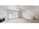 Inviting living room with a fireplace, large windows, and neutral walls at 488 Barclay Ct, Stone Mountain, GA 30083