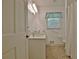 Bathroom with a marble countertop vanity, a window, and shower/tub at 501 Bridlepath Ln, Peachtree City, GA 30269
