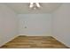 Bright bedroom with wood-look floors and a ceiling fan at 501 Bridlepath Ln, Peachtree City, GA 30269