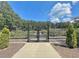 Gated community garden featuring raised garden beds and landscaped surroundings at 501 Bridlepath Ln, Peachtree City, GA 30269