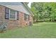 Brick home exterior featuring an AC unit and well-manicured lawn at 501 Bridlepath Ln, Peachtree City, GA 30269