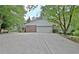 Spacious two-car garage with brick facade and large driveway for easy access and parking at 501 Bridlepath Ln, Peachtree City, GA 30269