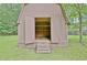 Exterior shot of shed with open doors showing interior shelves and storage at 501 Bridlepath Ln, Peachtree City, GA 30269