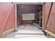 Shed interior featuring plywood walls, shelves, and an overhead light at 501 Bridlepath Ln, Peachtree City, GA 30269