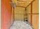 Clean shed interior, painted with exposed framing, shelves, and lighting at 501 Bridlepath Ln, Peachtree City, GA 30269