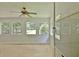 Bright sunroom with multiple windows and ceiling fan at 501 Bridlepath Ln, Peachtree City, GA 30269
